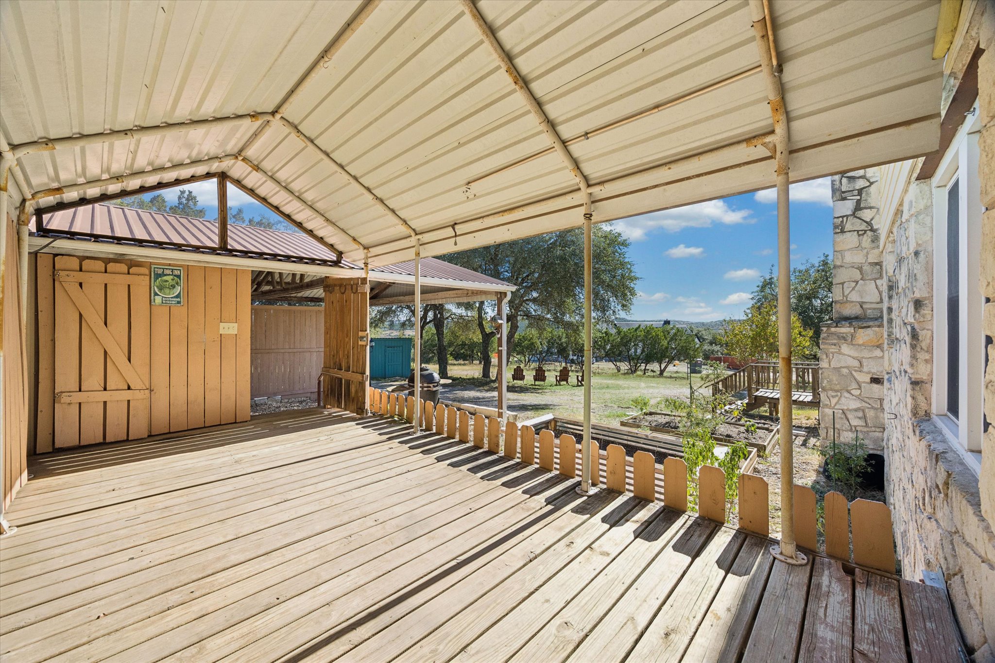 1091 Alta Vista Road Spicewood, TX 78669 - Photo 10 of 28 a view of a balcony with wooden floor
