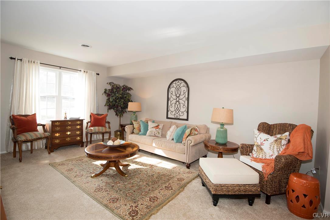 LARGE LIVING ROOM GETS WONDERFUL AFTERNOON LIGHT.