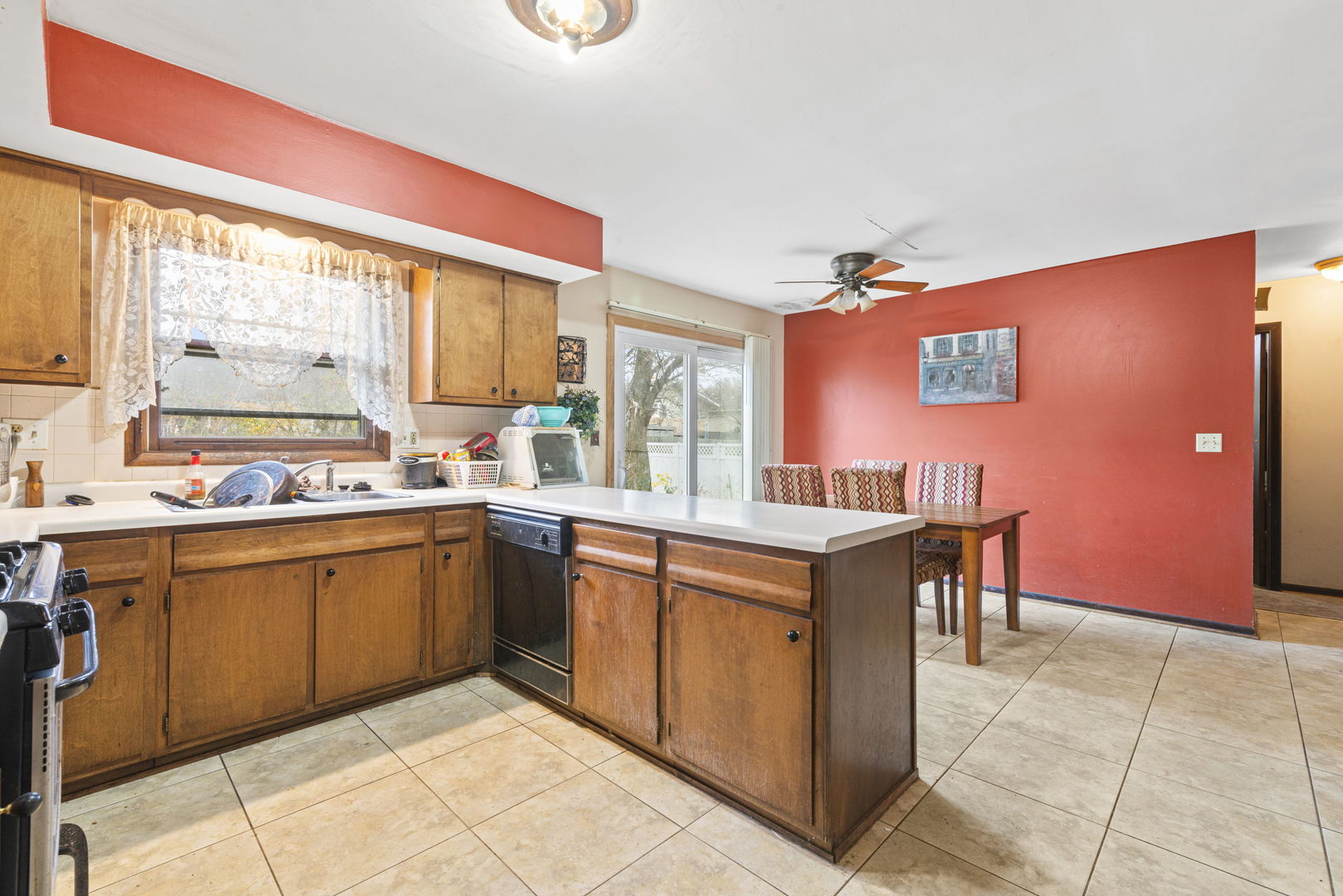 391 Cornell Lane Elgin, IL 60123 - Photo 3 of 20 a kitchen with stainless steel appliances granite countertop a sink and cabinets