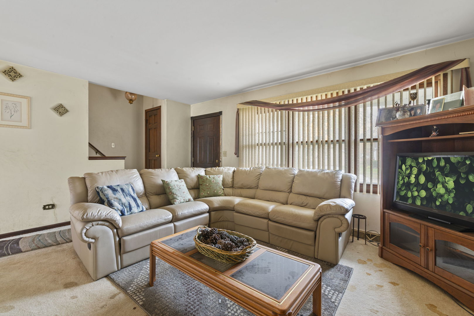 391 Cornell Lane Elgin, IL 60123 - Photo 7 of 20 a living room with furniture a flat screen tv and a large window