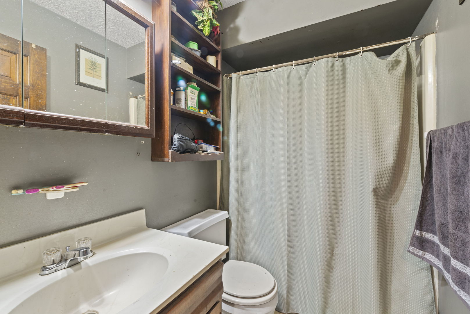 391 Cornell Lane Elgin, IL 60123 - Photo 10 of 20 a bathroom with a sink toilet and shower