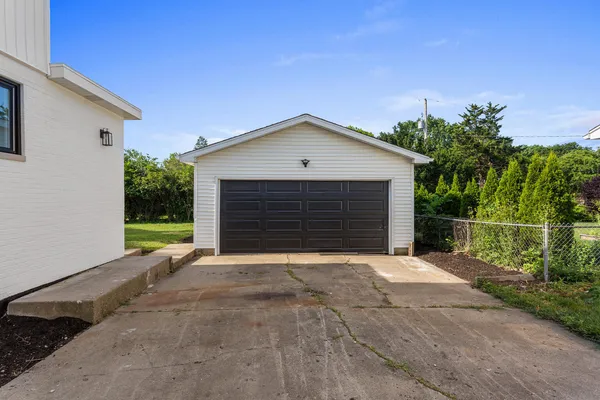 a front view of a house with garage