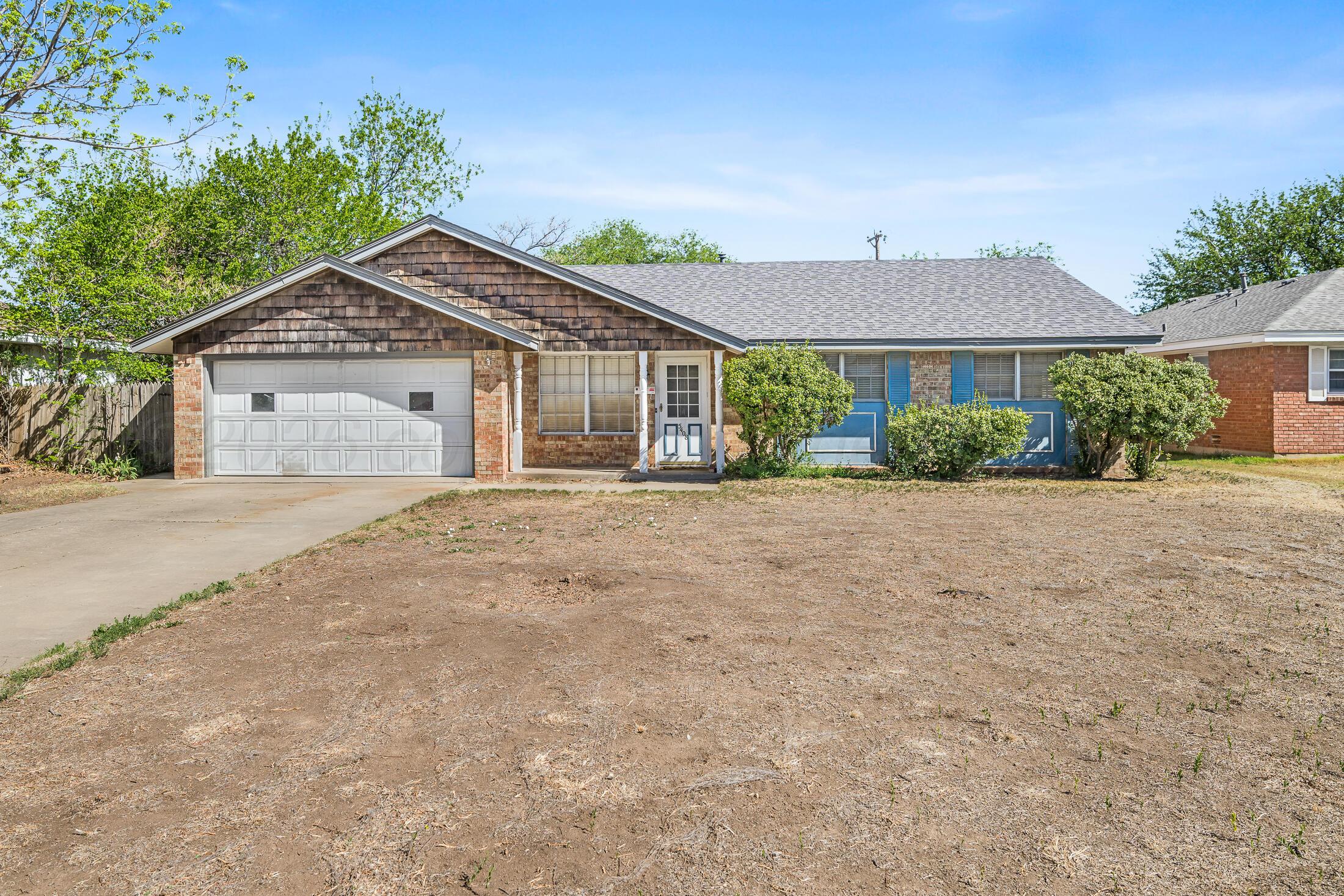 front view of a house with a yard