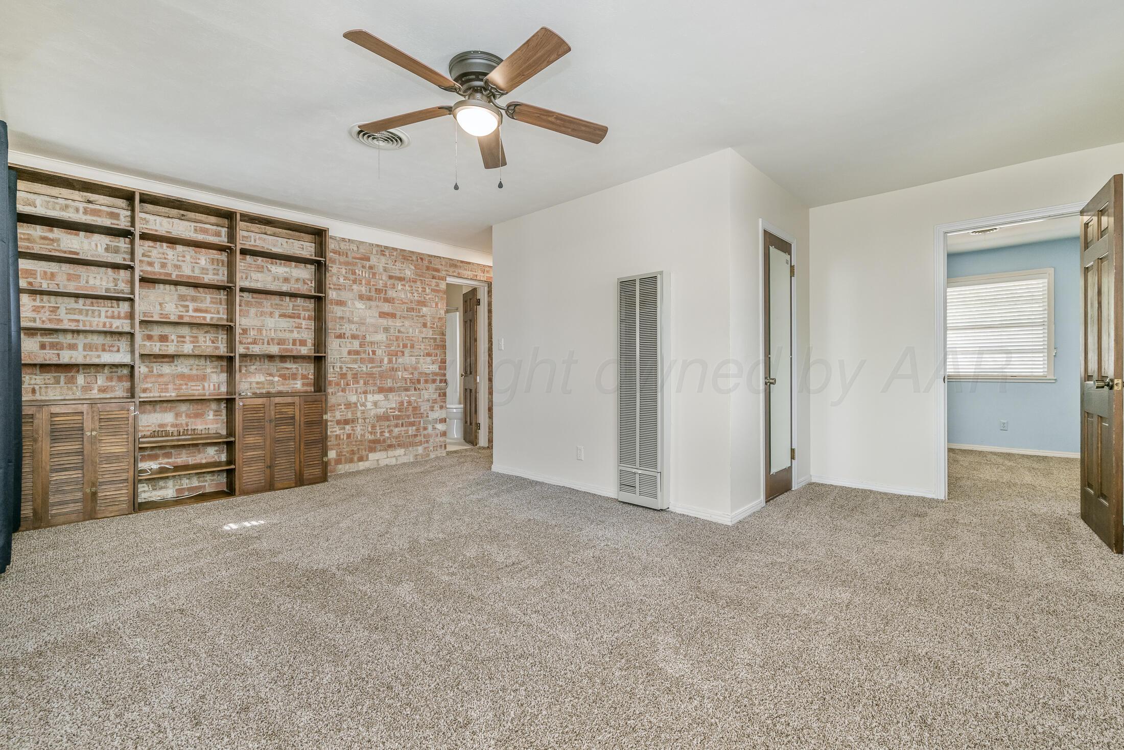 5408 George Terrace Amarillo, TX 79106 - Photo 15 of 26 an empty room with furniture and a ceiling fan