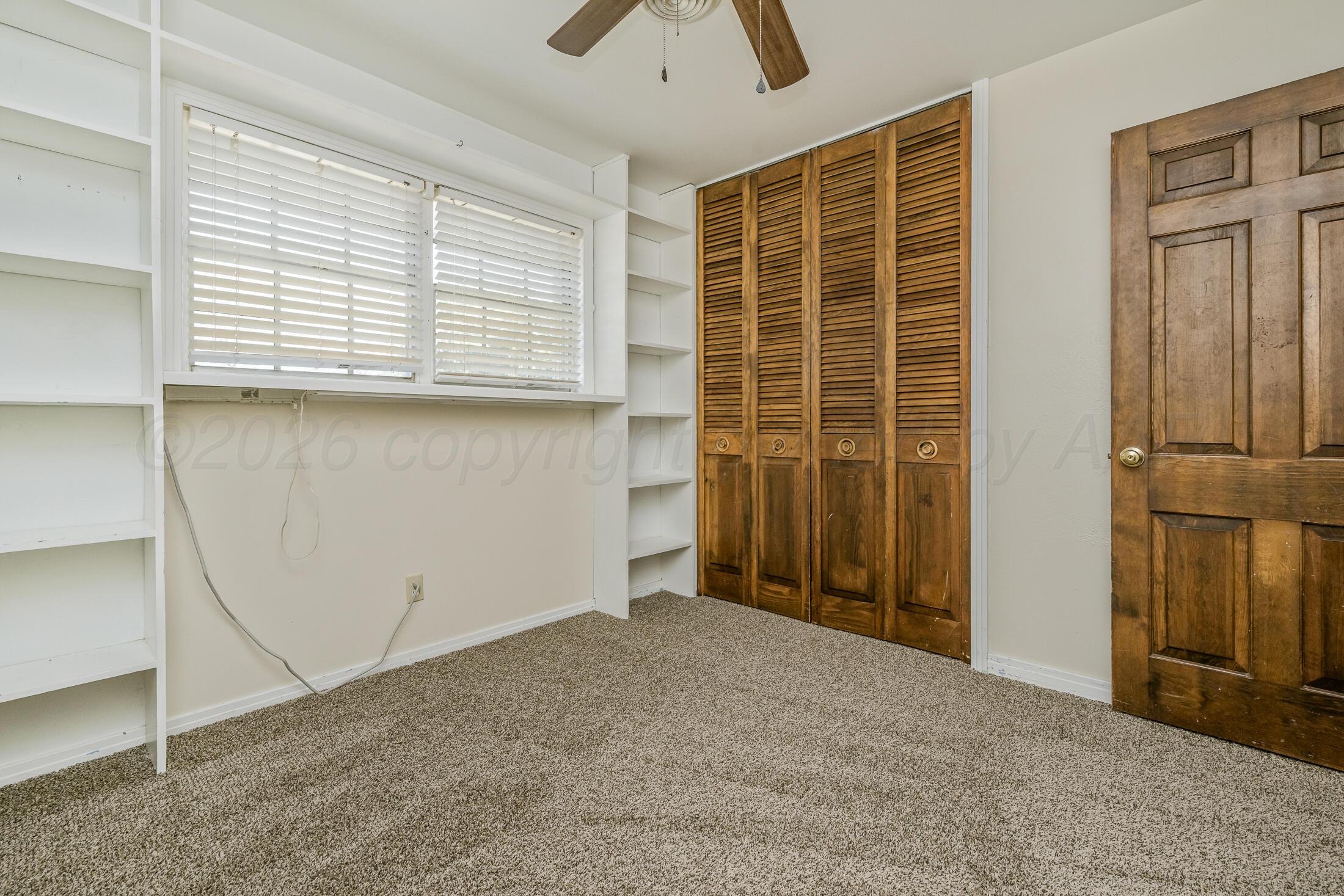 5408 George Terrace Amarillo, TX 79106 - Photo 20 of 26 an empty room with windows
