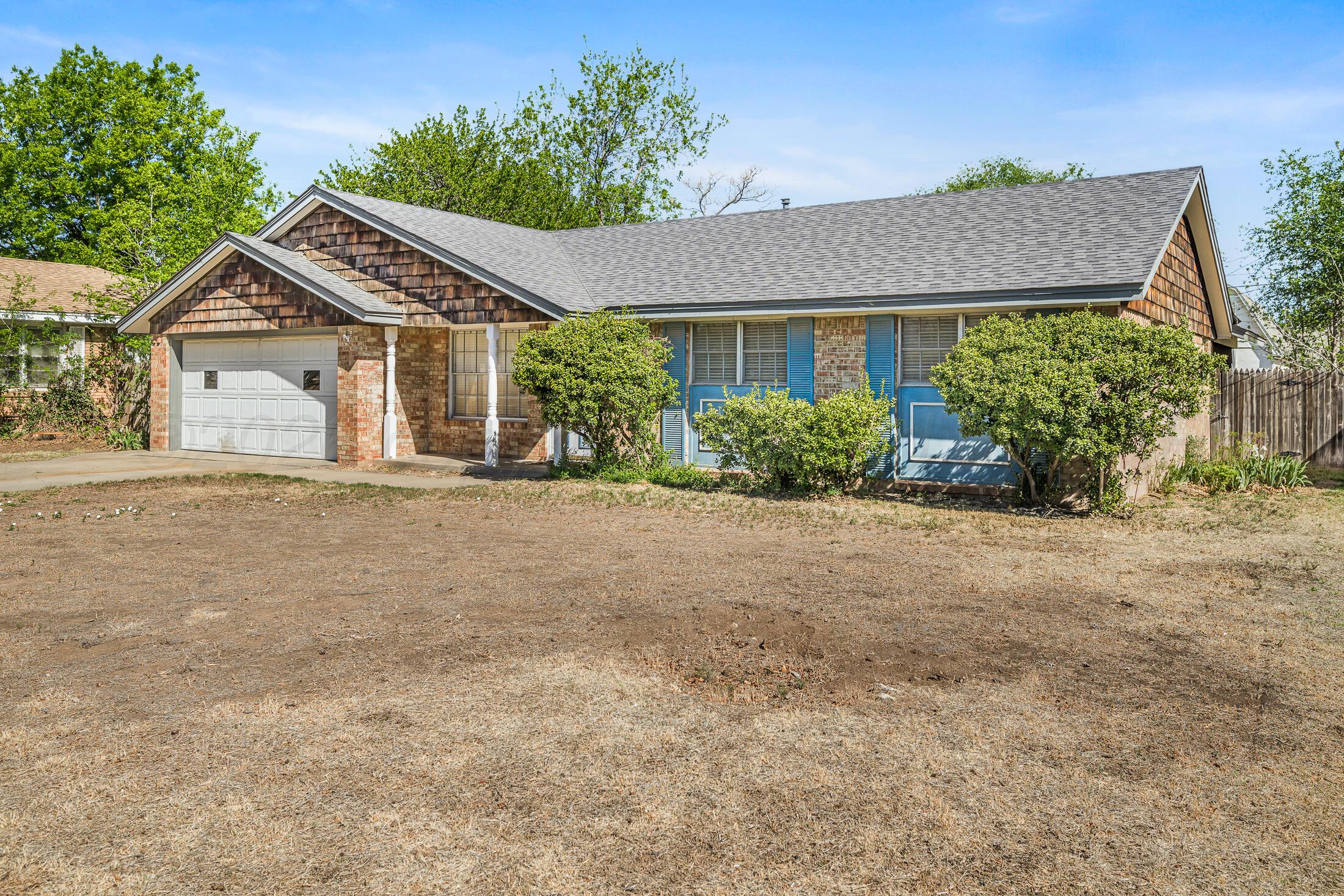 5408 George Terrace Amarillo, TX 79106 - Photo 2 of 26 a front view of a house with a yard