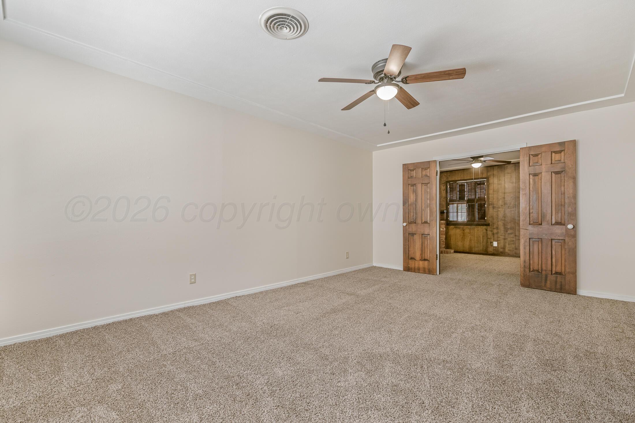5408 George Terrace Amarillo, TX 79106 - Photo 4 of 26 an empty room with closet and a ceiling fan