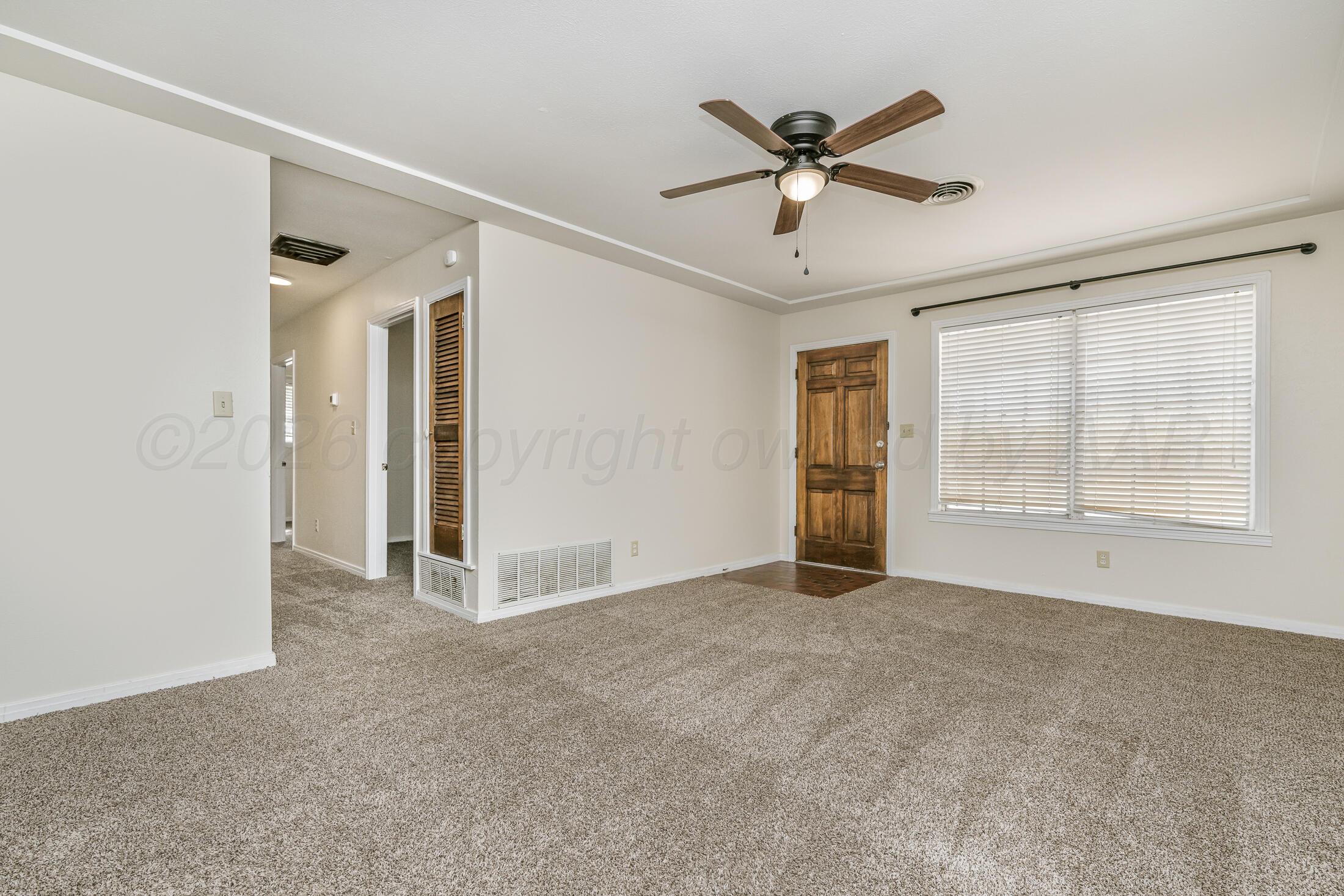 5408 George Terrace Amarillo, TX 79106 - Photo 5 of 26 a view of an empty room with a ceiling fan