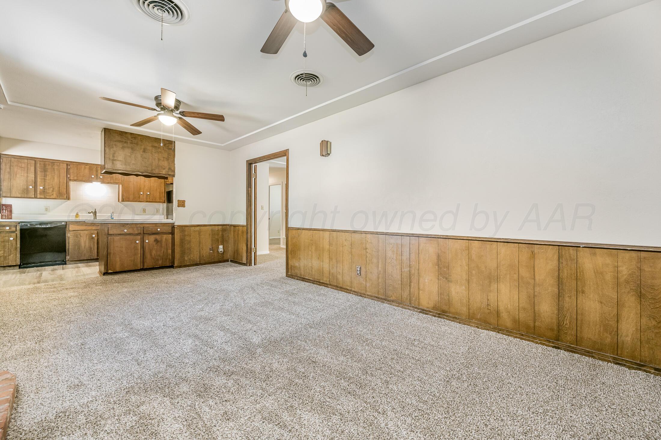 5408 George Terrace Amarillo, TX 79106 - Photo 8 of 26 an empty room with ceiling fan and windows
