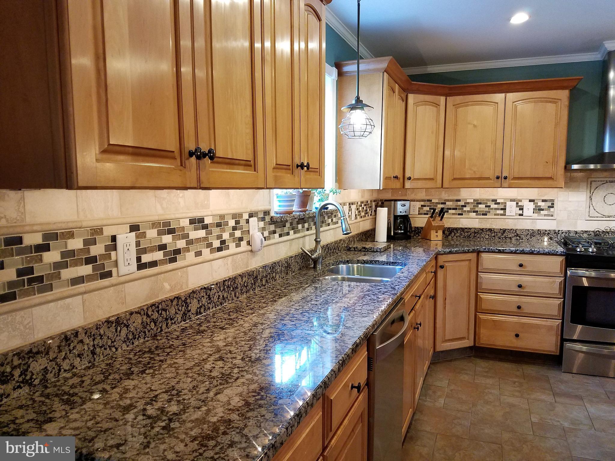 2920 Duncan Road White Hall, MD 21161 - Photo 6 of 40 Granite Counters Maple Finished Cabinets