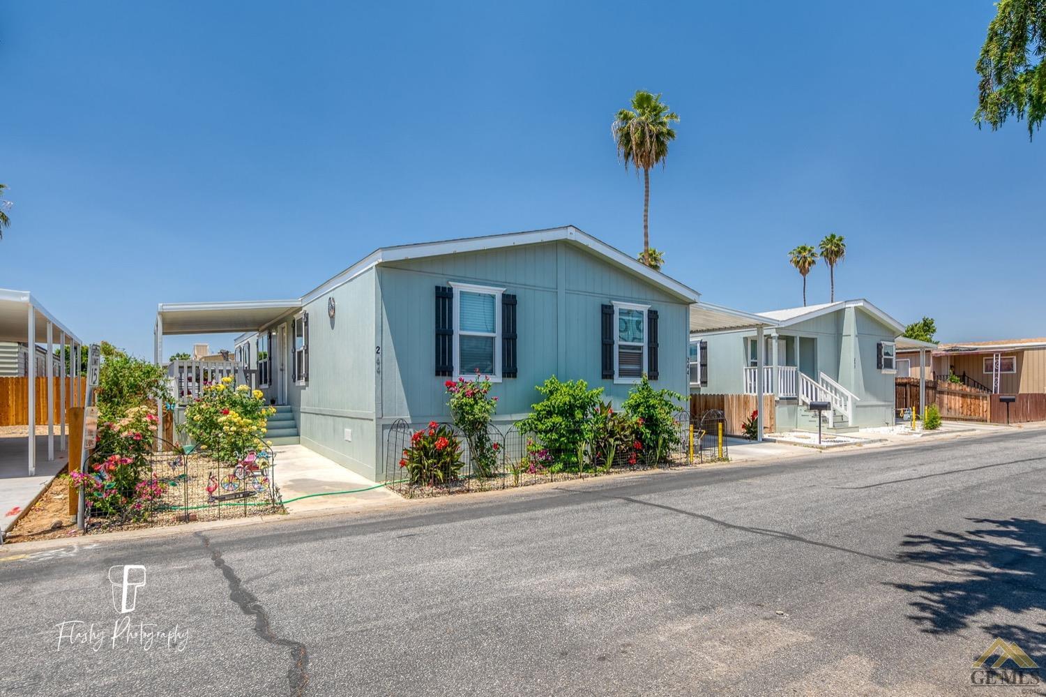 Undisclosed Address Bakersfield, CA 93308 - Photo 2 of 32 a front view of a house with a yard