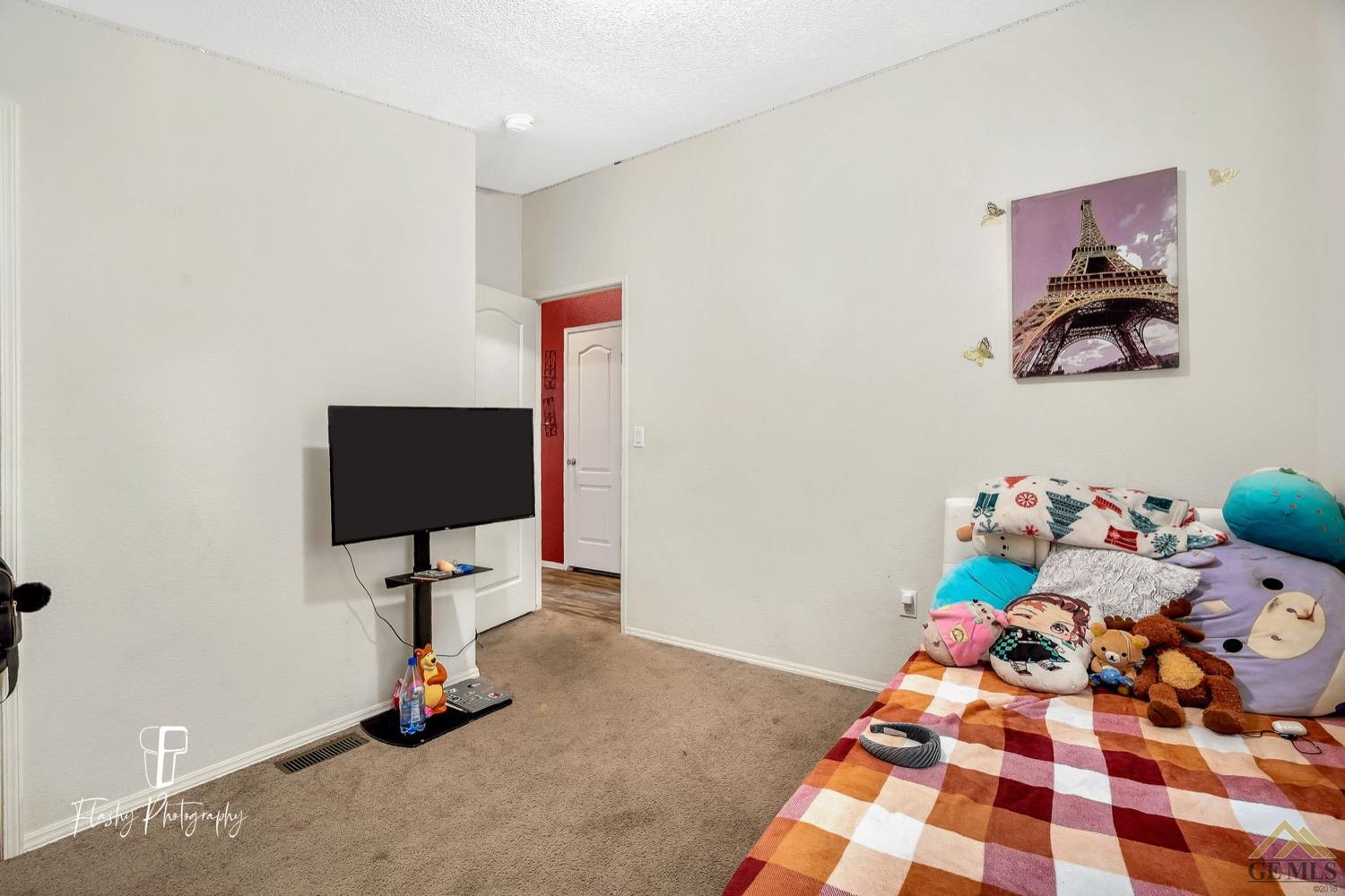 Undisclosed Address Bakersfield, CA 93308 - Photo 27 of 32 a room with toys and hard wood floor