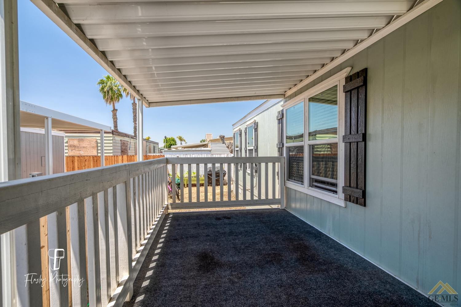 Undisclosed Address Bakersfield, CA 93308 - Photo 4 of 32 a porch with wooden floor