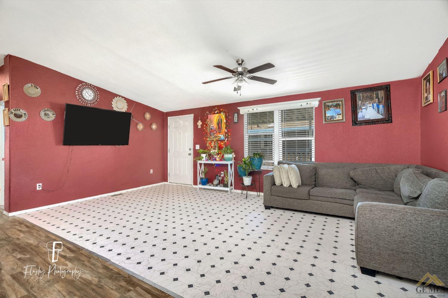 Undisclosed Address Bakersfield, CA 93308 - Photo 9 of 32 a living room with furniture and a flat screen tv