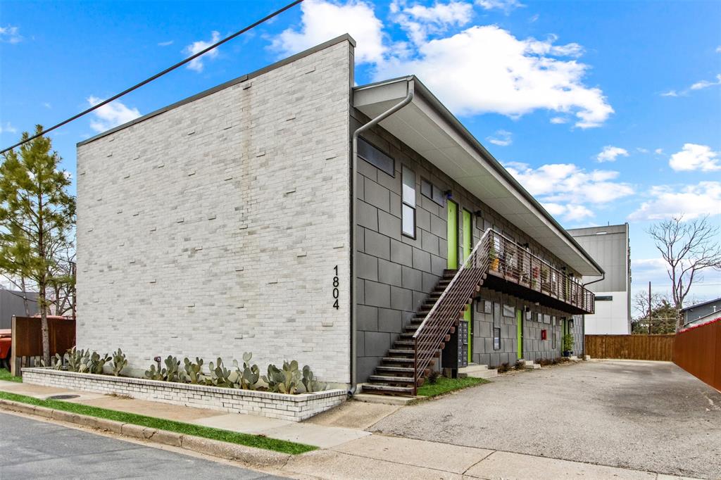 1804 Gould Street, Unit 3 Dallas, TX 75215 - Photo 1 of 19 a front view of a house with a garden