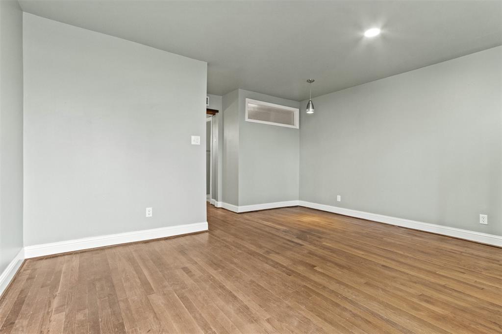 1804 Gould Street, Unit 3 Dallas, TX 75215 - Photo 2 of 19 a view of an empty room with wooden floor