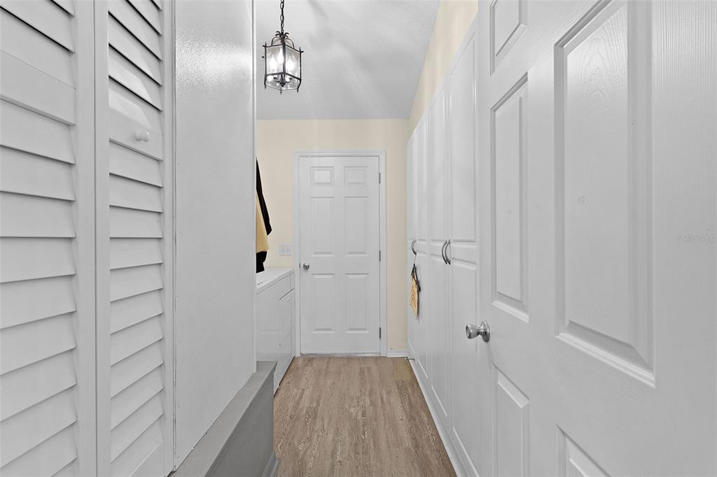 2583 Raintree Drive The Villages, FL 32162 - Photo 36 of 56 a view of a hallway with wooden floor and entryway