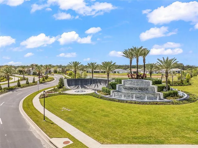 a view of a swimming pool with a table and chairs