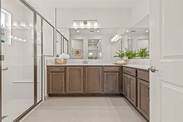 a bathroom with a sink a vanity and a mirror