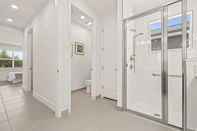 a bathroom with a tub and shower