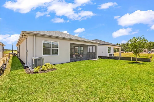 a view of a house with backyard