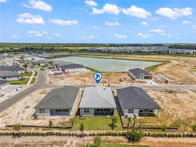 an aerial view of a house with a ocean view