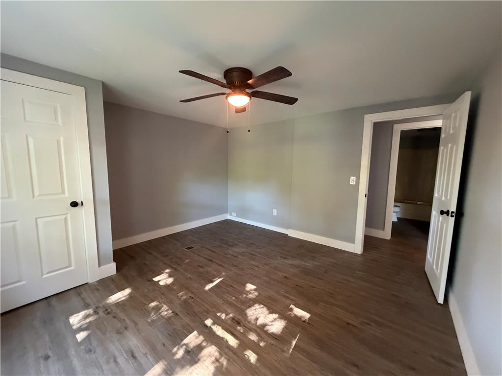 19 Springridge Road Bath, PA 18014 - Photo 22 of 29 Plank flooring and simple white trim define this versatile room with an attached bathroom.
