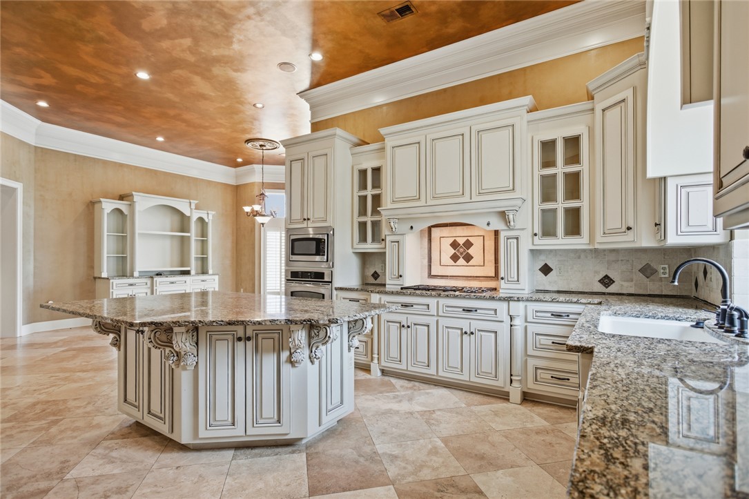 610 Highridge Drive Seneca, SC 29672 - Photo 14 of 50 This spacious kitchen offers a large island, elegant countertops, and contemporary appliances.