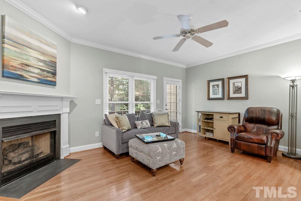 1303 Cameron View Court Raleigh, NC 27608 - Photo 11 of 30 a living room with furniture and a fireplace