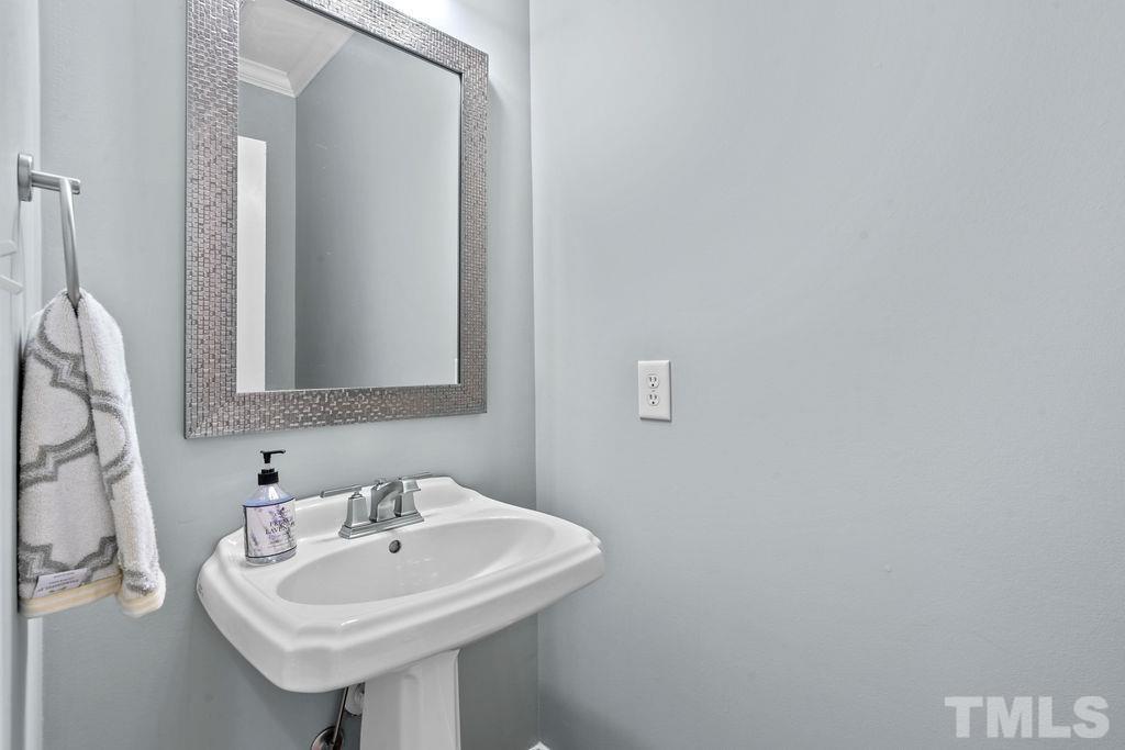 1303 Cameron View Court Raleigh, NC 27608 - Photo 12 of 30 a bathroom with a sink and a mirror