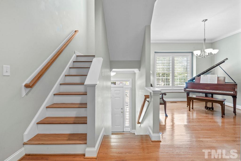 1303 Cameron View Court Raleigh, NC 27608 - Photo 3 of 30 a view of entryway and hall with wooden floor