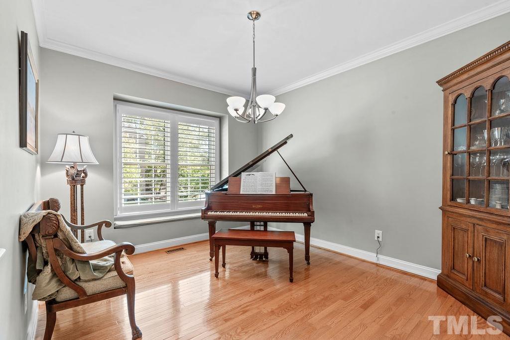 1303 Cameron View Court Raleigh, NC 27608 - Photo 4 of 30 a living room with furniture and a wooden floor