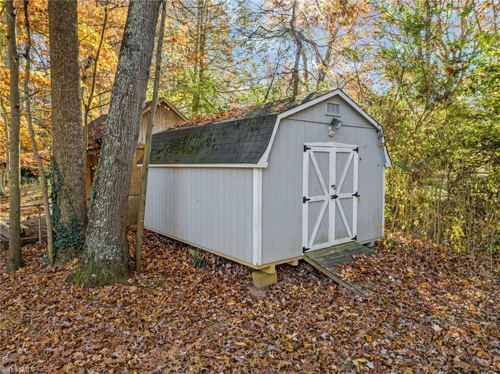 154 Longview Road Madison, NC 27025 - Photo 34 of 44 Wired 12x16 storage building in back yard