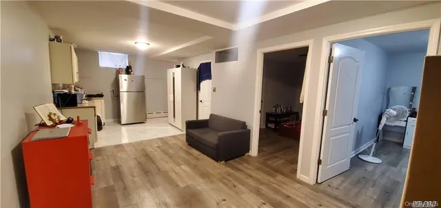 a bed sitting in a bedroom next to a wooden door