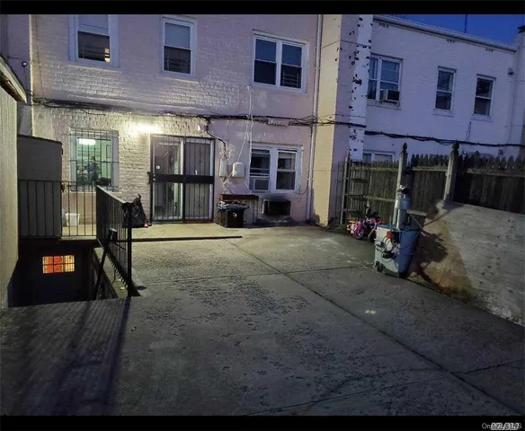 a view of a brick building with many windows