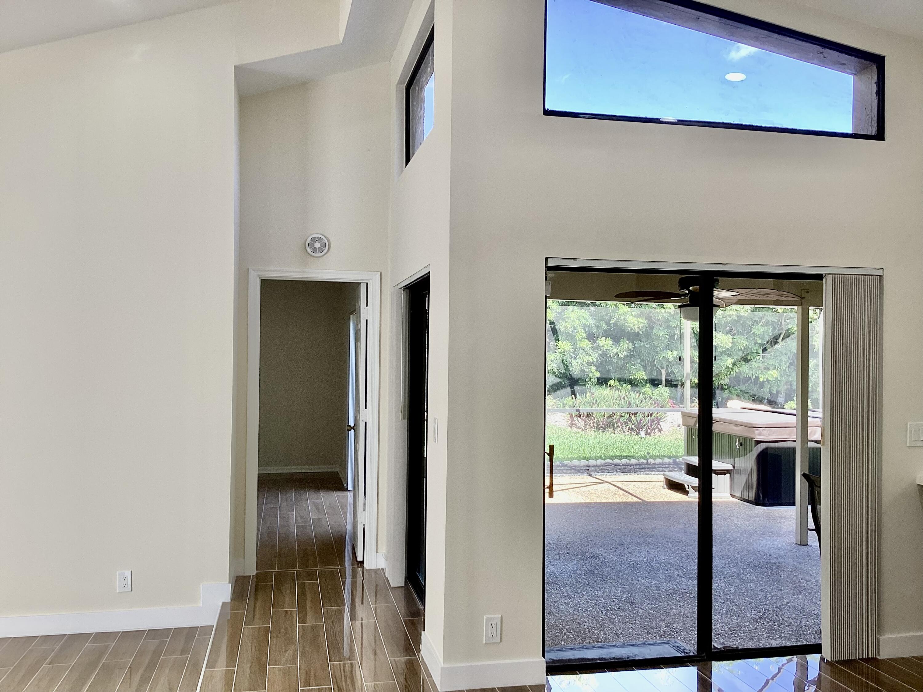 8895 Old Pine Road, Unit 4 Boca Raton, FL 33433 - Photo 16 of 46 a view of a living room with a balcony