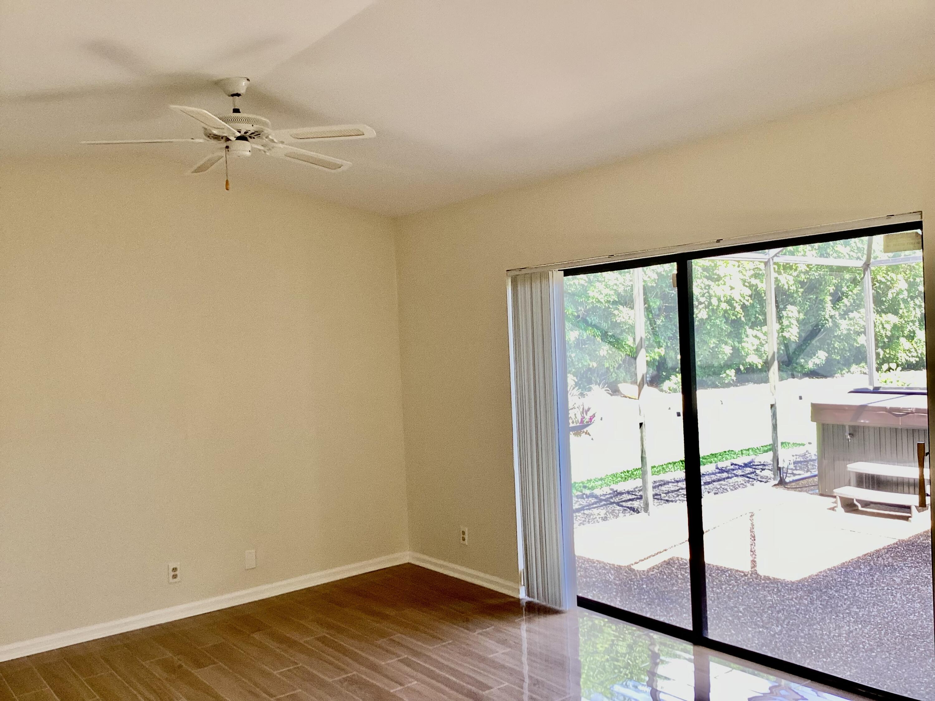 8895 Old Pine Road, Unit 4 Boca Raton, FL 33433 - Photo 17 of 46 a view of a room with a window and a ceiling fan