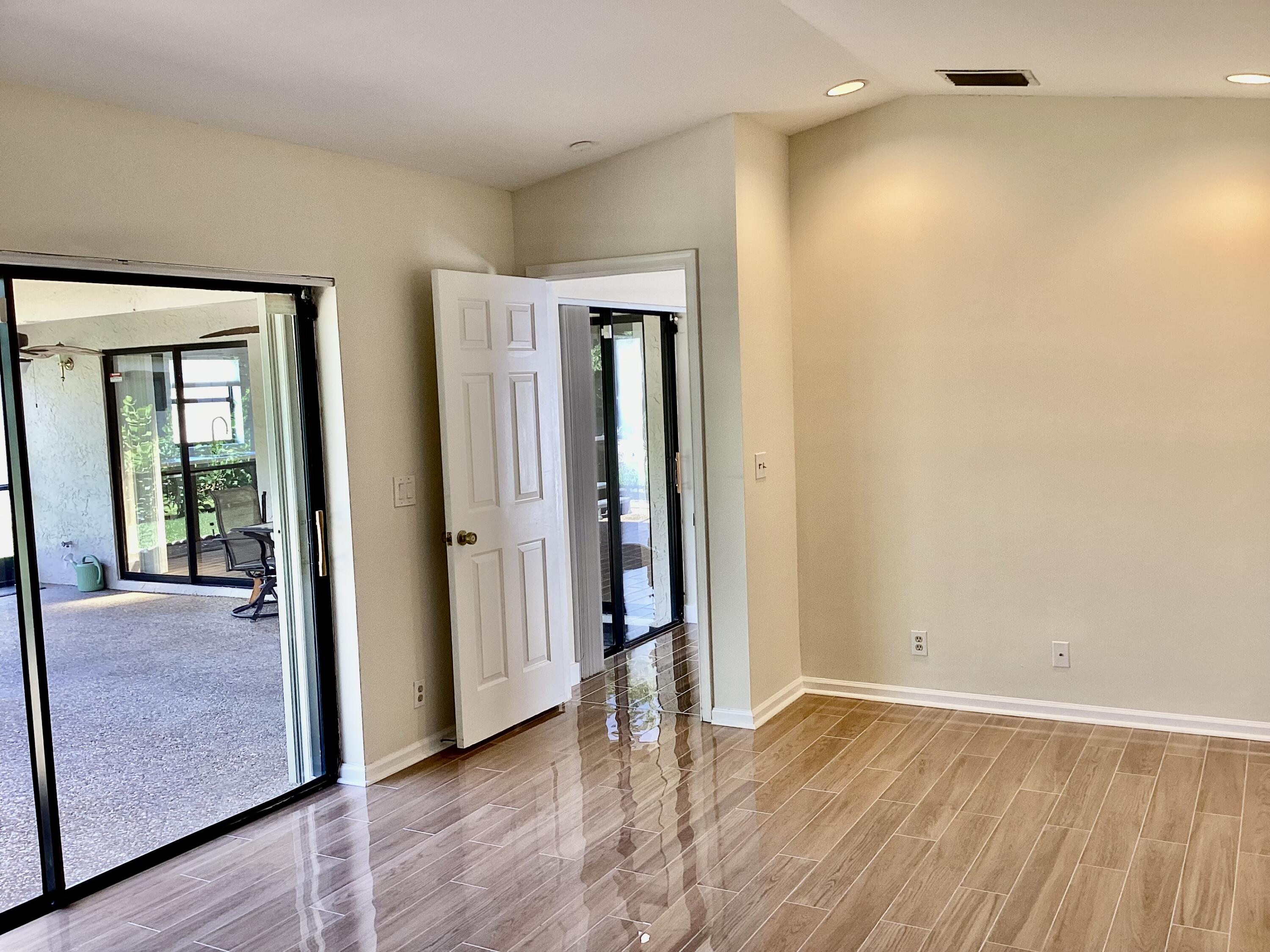 8895 Old Pine Road, Unit 4 Boca Raton, FL 33433 - Photo 18 of 46 wooden floor in an empty room with a window