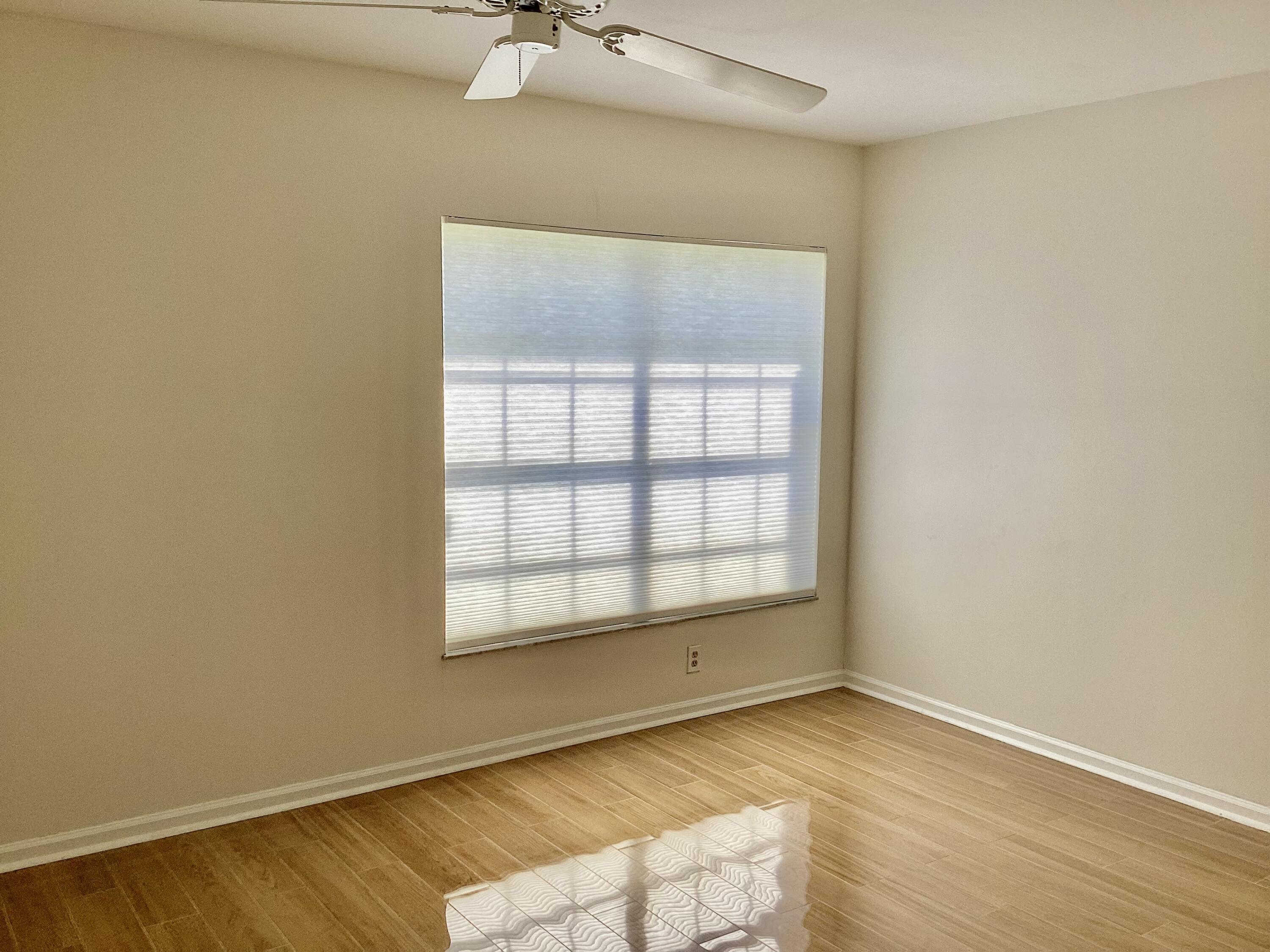 8895 Old Pine Road, Unit 4 Boca Raton, FL 33433 - Photo 24 of 46 an empty room with a window