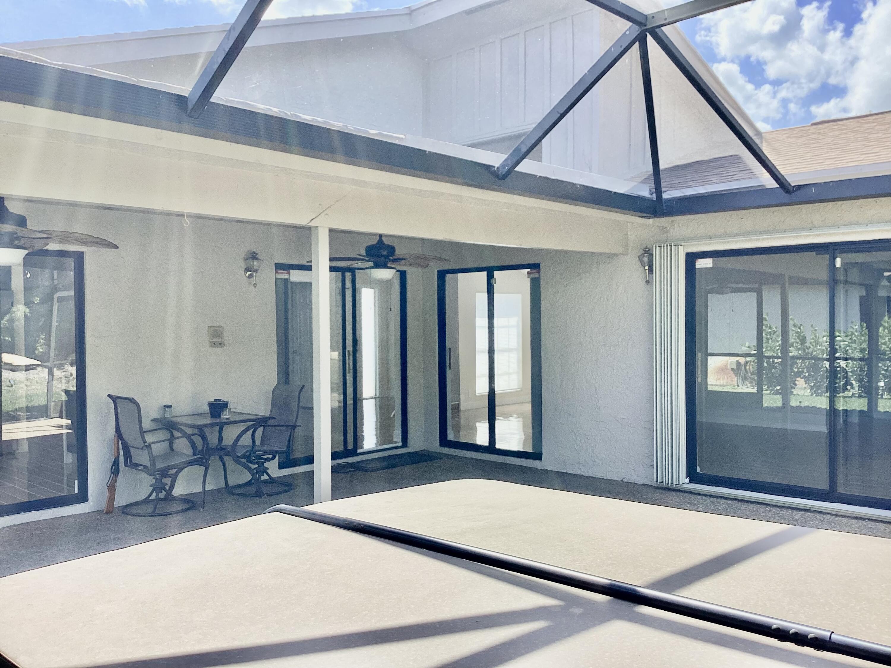 8895 Old Pine Road, Unit 4 Boca Raton, FL 33433 - Photo 33 of 46 a view of a livingroom with furniture and door