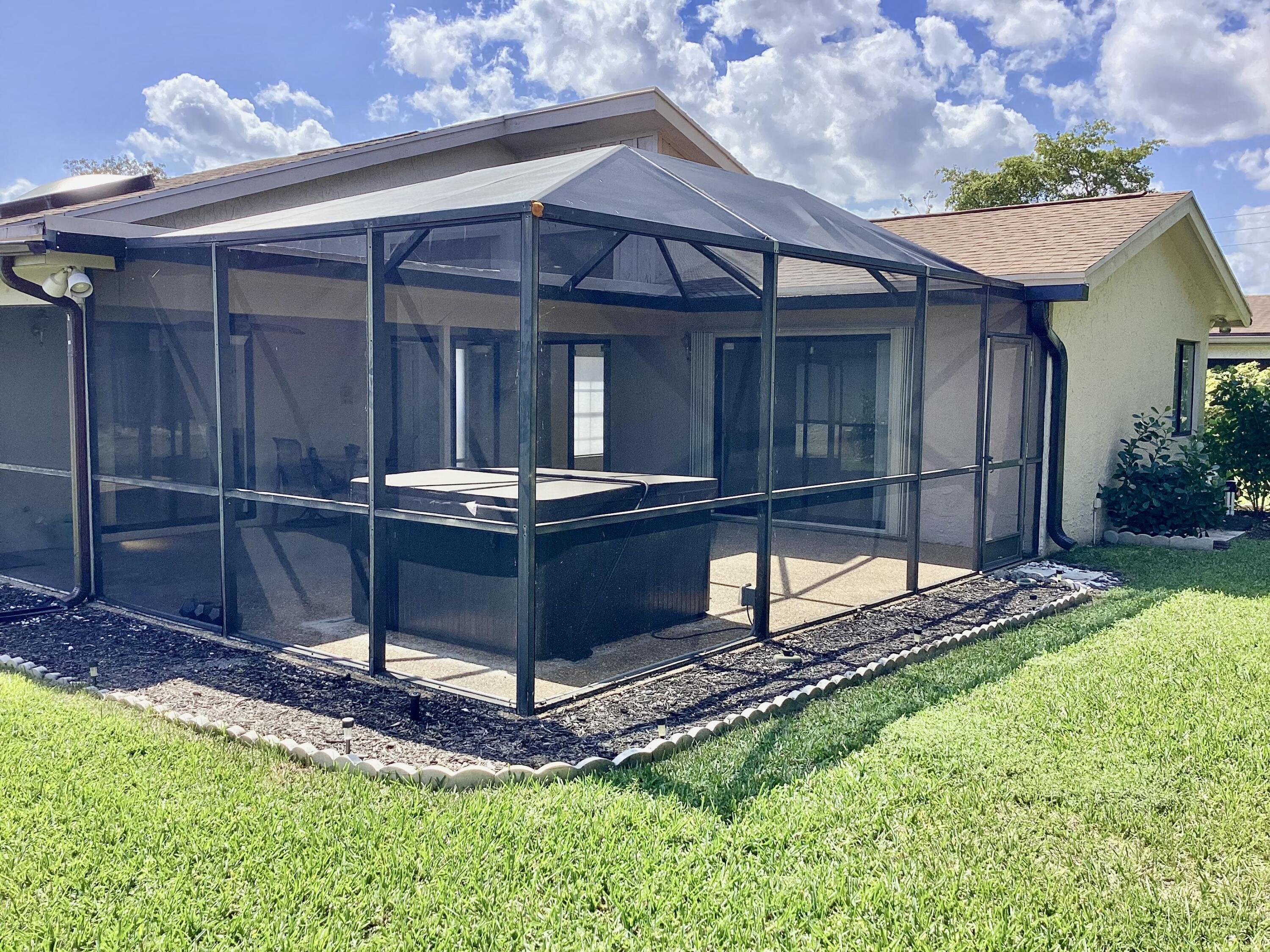 8895 Old Pine Road, Unit 4 Boca Raton, FL 33433 - Photo 34 of 46 a front view of a house with garden