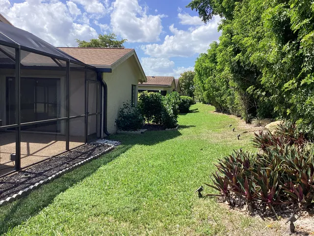 a view of a backyard with a barn