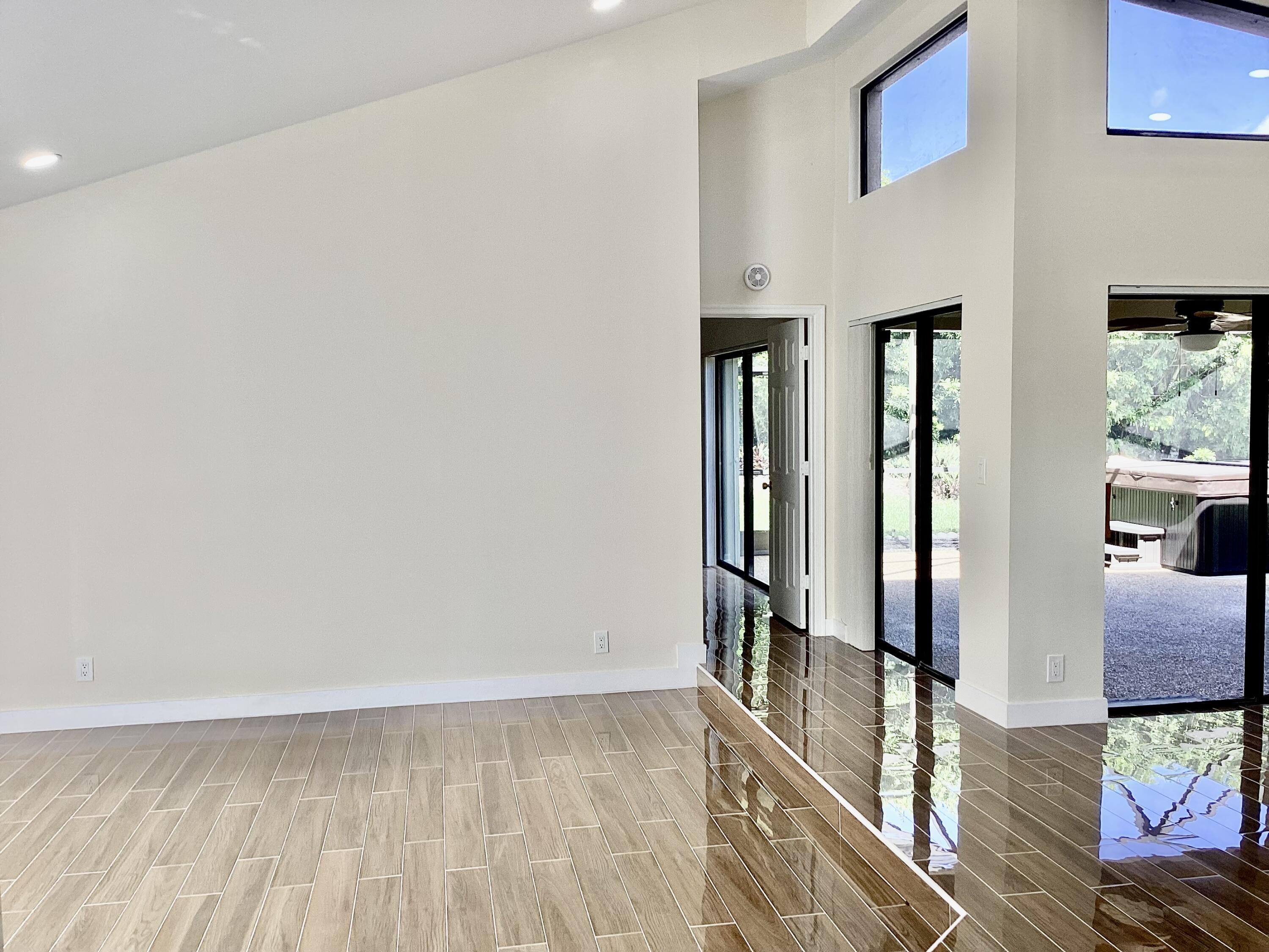 8895 Old Pine Road, Unit 4 Boca Raton, FL 33433 - Photo 4 of 46 wooden floor in a an empty room