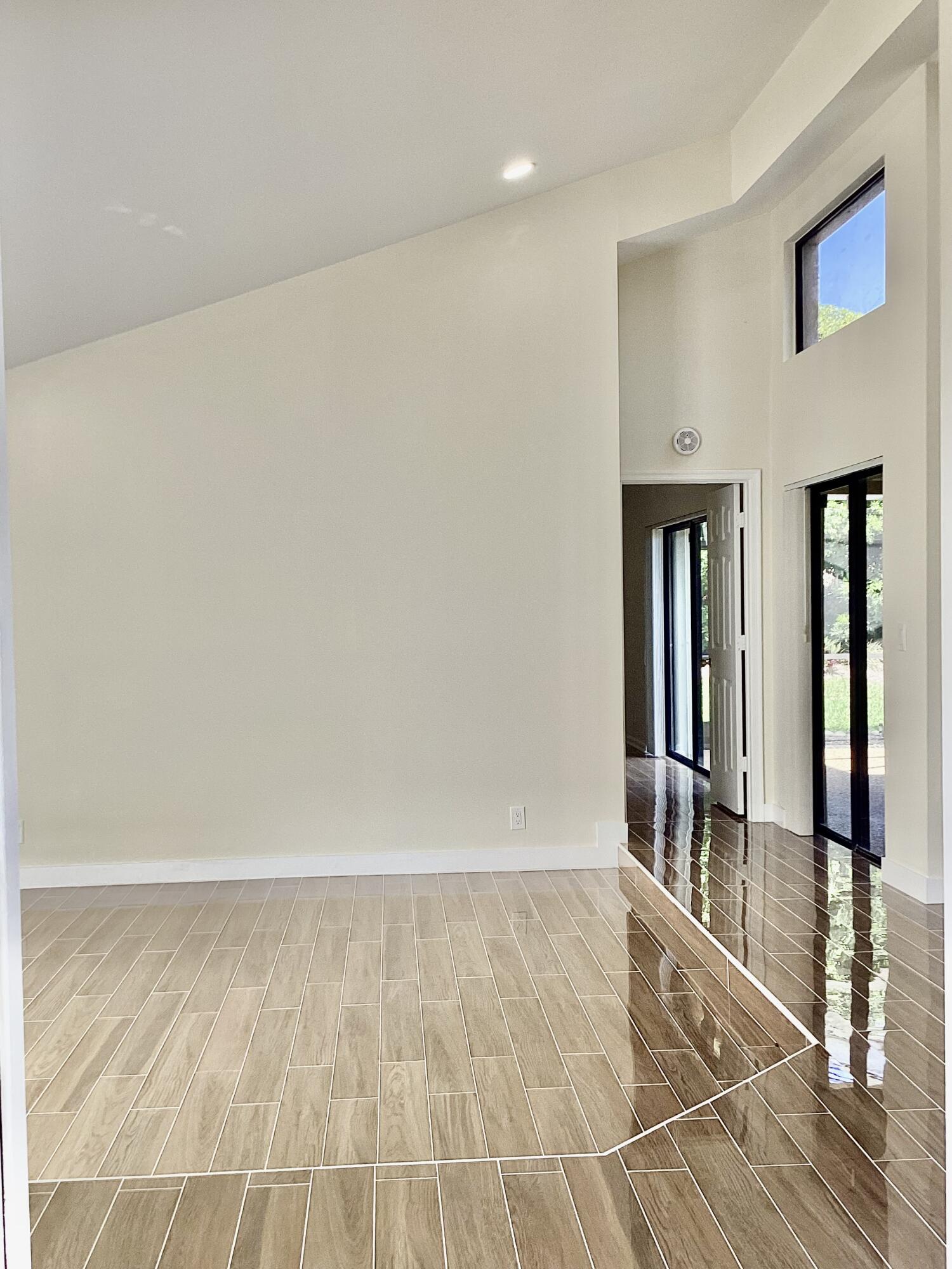 8895 Old Pine Road, Unit 4 Boca Raton, FL 33433 - Photo 6 of 46 a view of an empty room with glass door