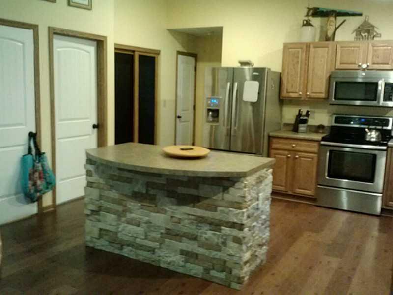 1262 Hartzell Road New Castle, PA 16105 - Photo 7 of 21 Kitchen. lower level access, laundry, and pantry right off the kitchen.