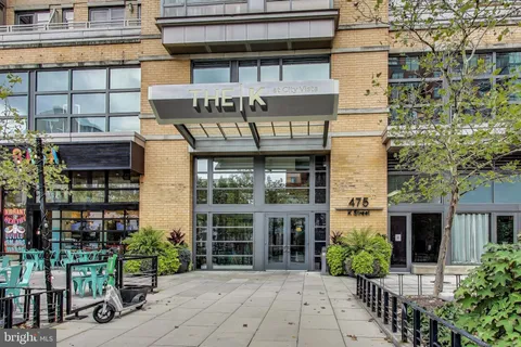 a view of a building with potted plants