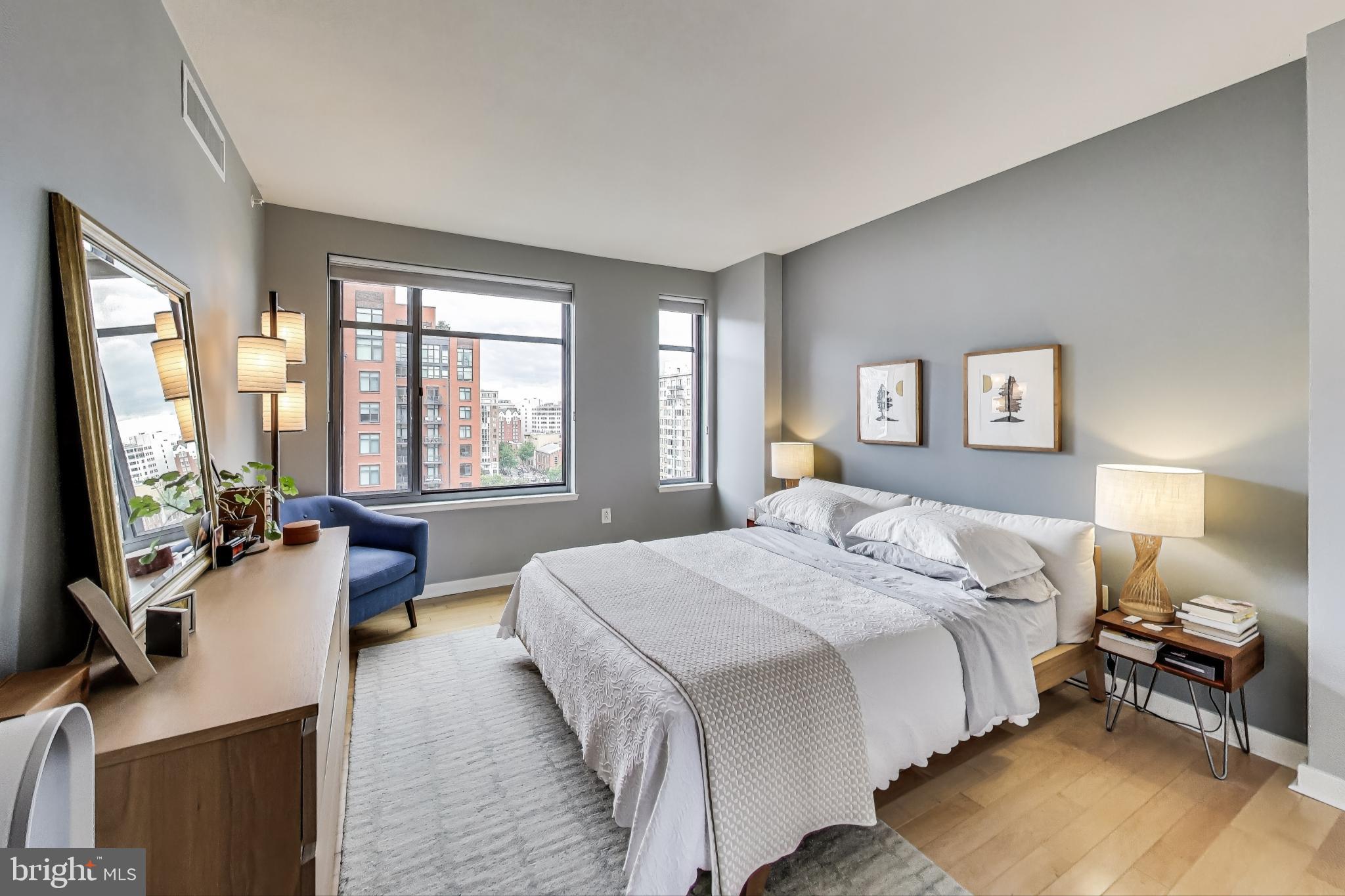 475 K Street Northwest, Unit 919 Washington, DC 20001 - Photo 13 of 43 a spacious bedroom with a bed and a large window