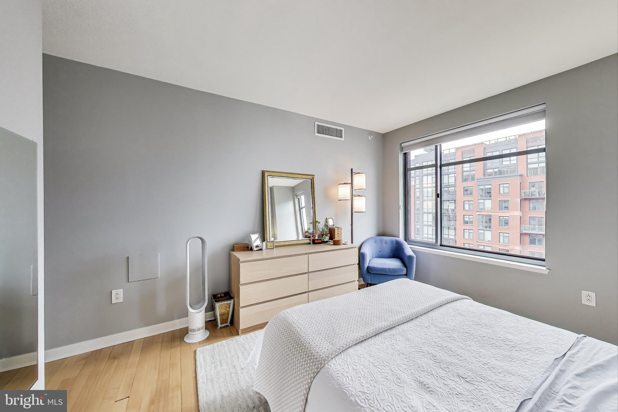 475 K Street Northwest, Unit 919 Washington, DC 20001 - Photo 15 of 43 a bedroom with a bed and wooden floor