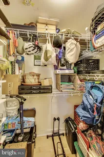 a kitchen with a stove and a wooden floor
