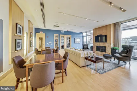 a living room with fireplace furniture and a flat screen tv